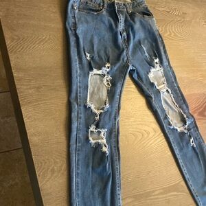 American Bazi jeans with the rips  size 11  in good condition no stains